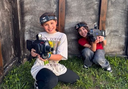 An image of two Jellystone campers having fun playing laser tag. An image of two Jellystone campers having fun playing laser tag.