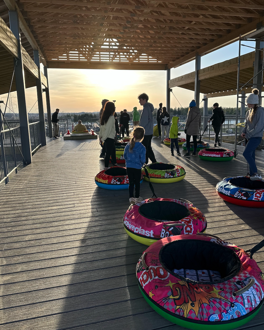 Kids line up to slide down Randy's Thrill Hill at Bear Paw Adventure Park.