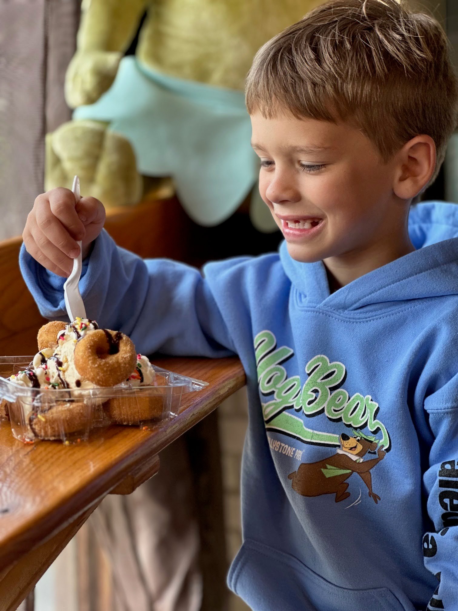 An image from the Rec Center of a Jellystone camper eating.
