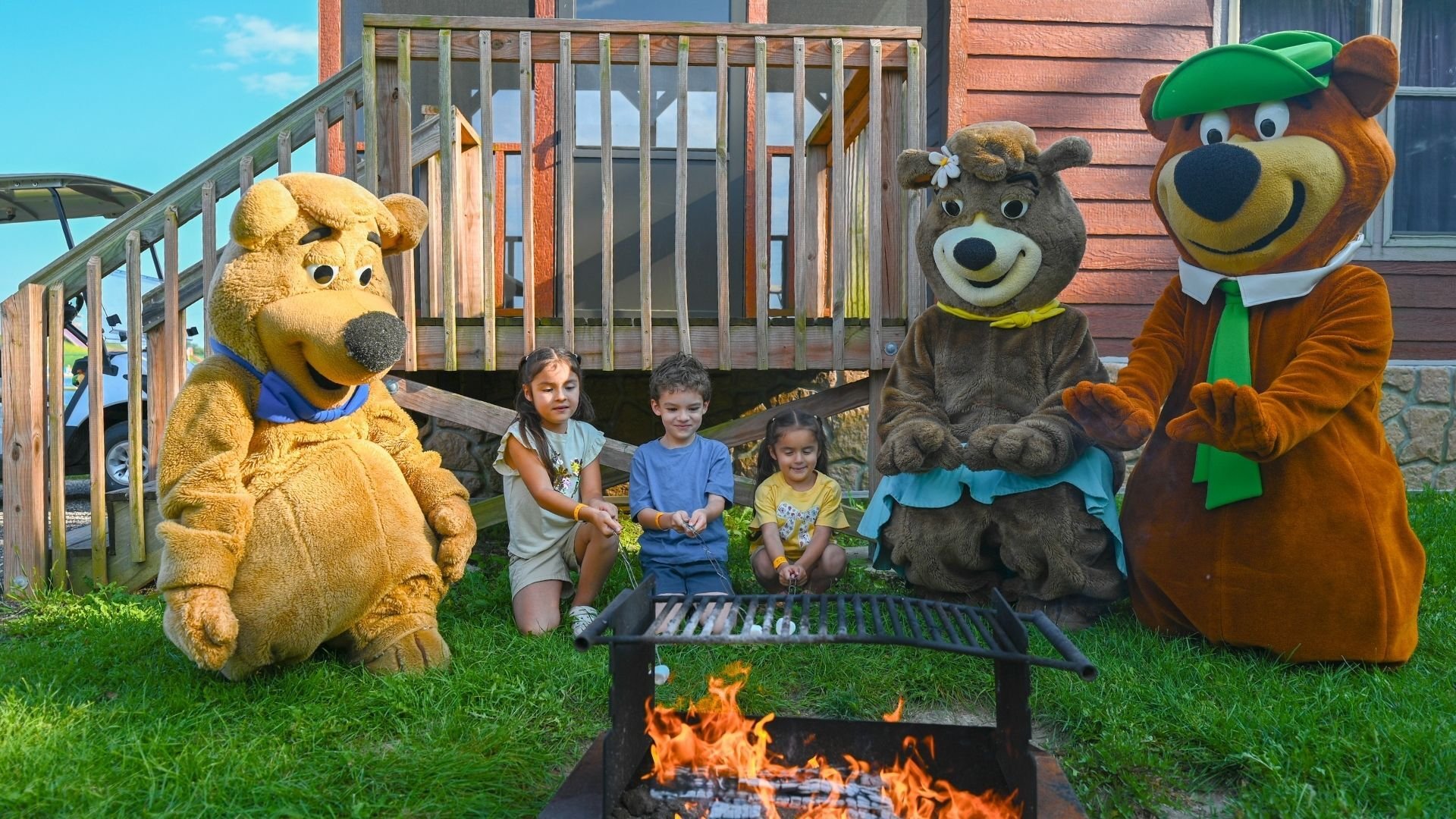 An image from Jellystone Park Caledonia showing a family of campers having fun with the Bears. An image from Jellystone Park Caledonia showing a family of campers having fun with the Bears.