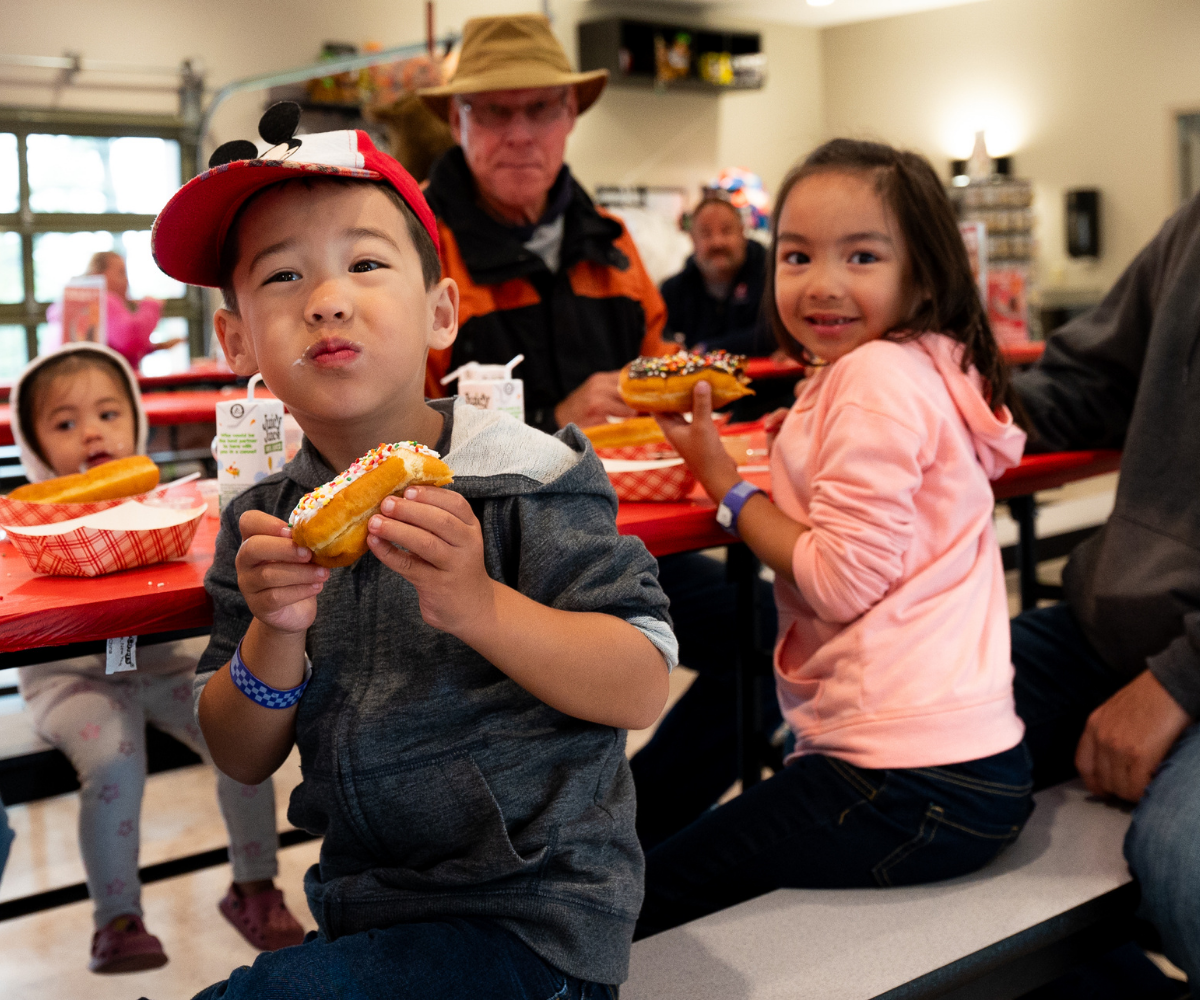 Two campers participating in a recreation activity at The Recreation Center™ in Jellystone Park™ Caledonia