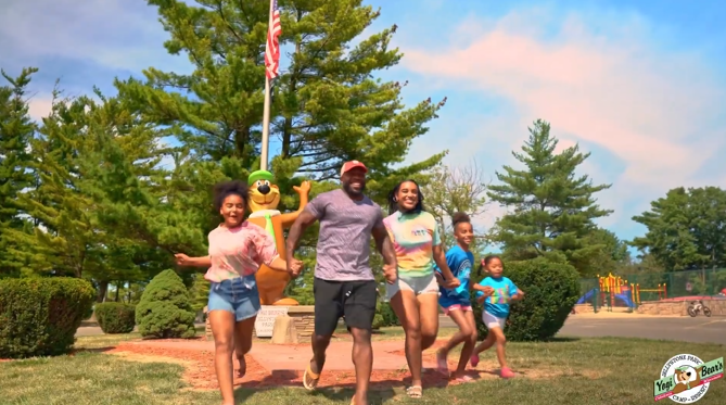 jellystone.park.family.running.happy.cabin.camping