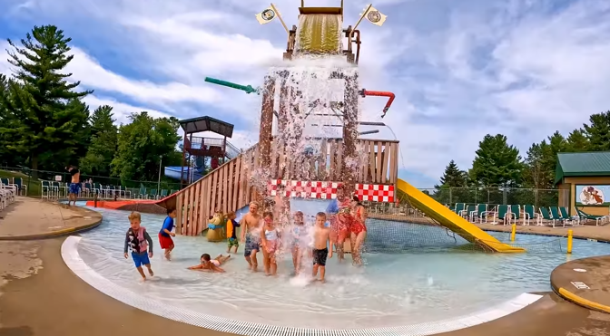 An image of campers playing in the splash zone at Jellystone Park™ Caledonia.