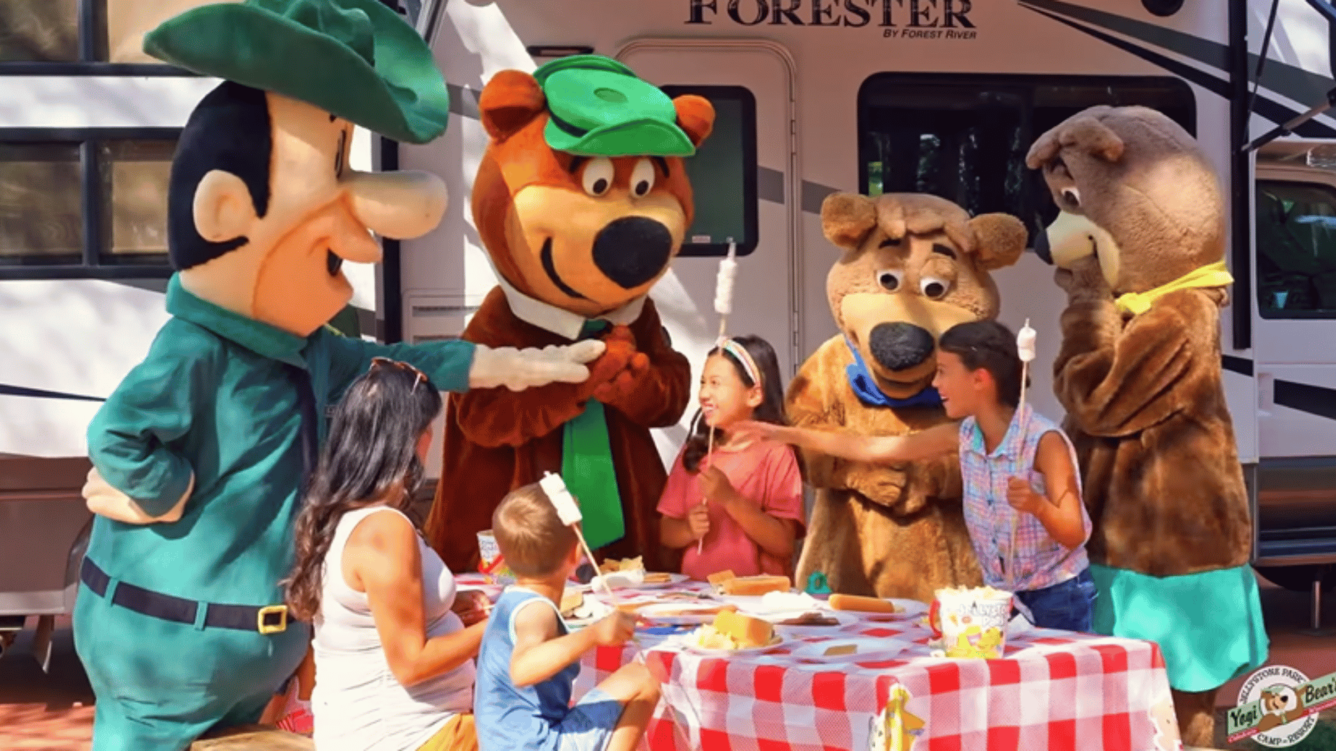 An image of Jellystone Park campers with our mascots outside of their RV. An image of Jellystone Park campers with our mascots outside of their RV.