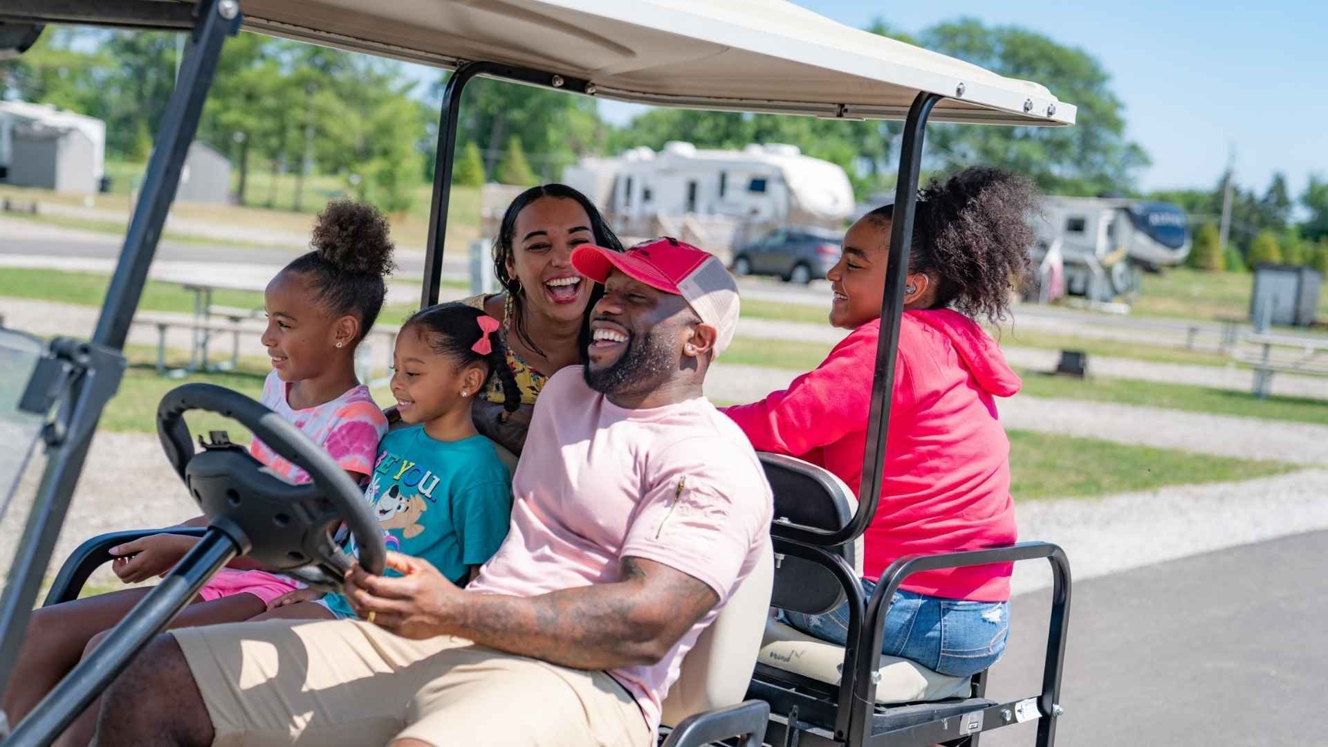 An image of of a family having fun on a golf cart at Jellystone Park. An image of of a family having fun on a golf cart at Jellystone Park.