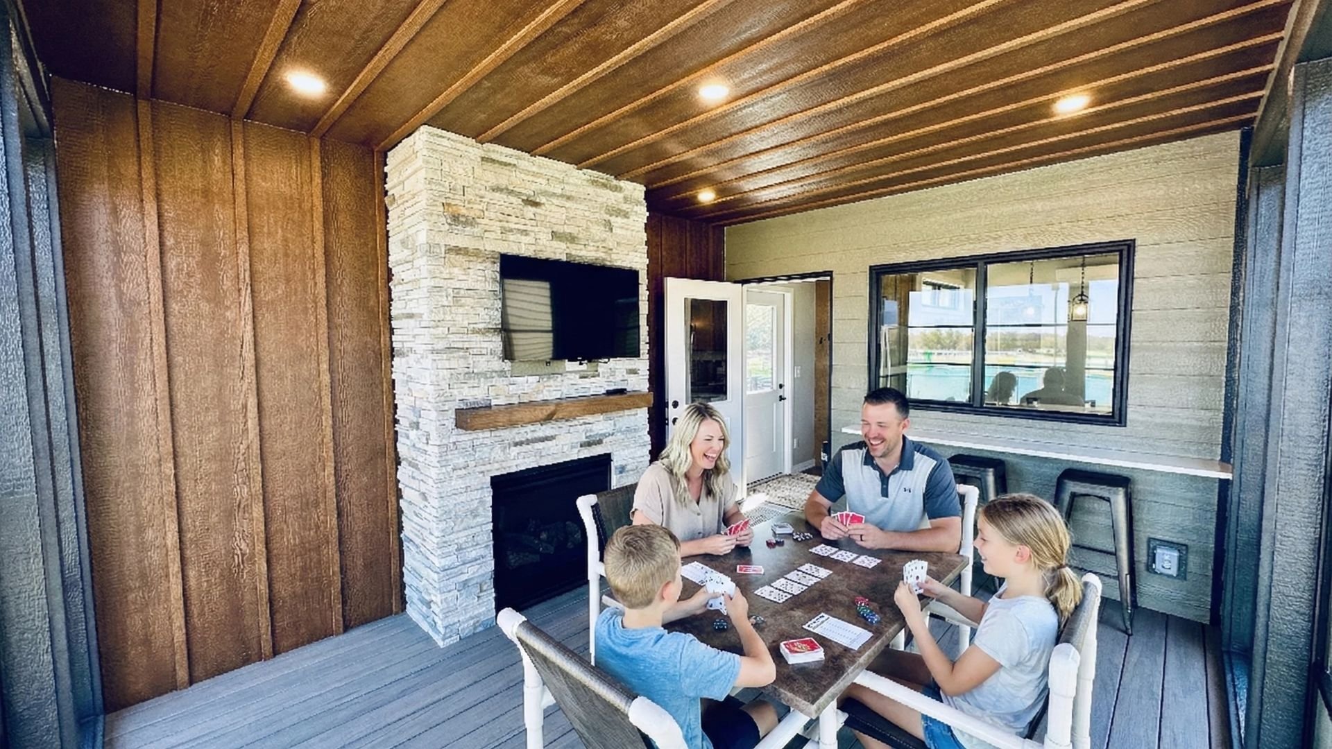 An image of a family having fun at their glamping cabin at Jellystone Park.