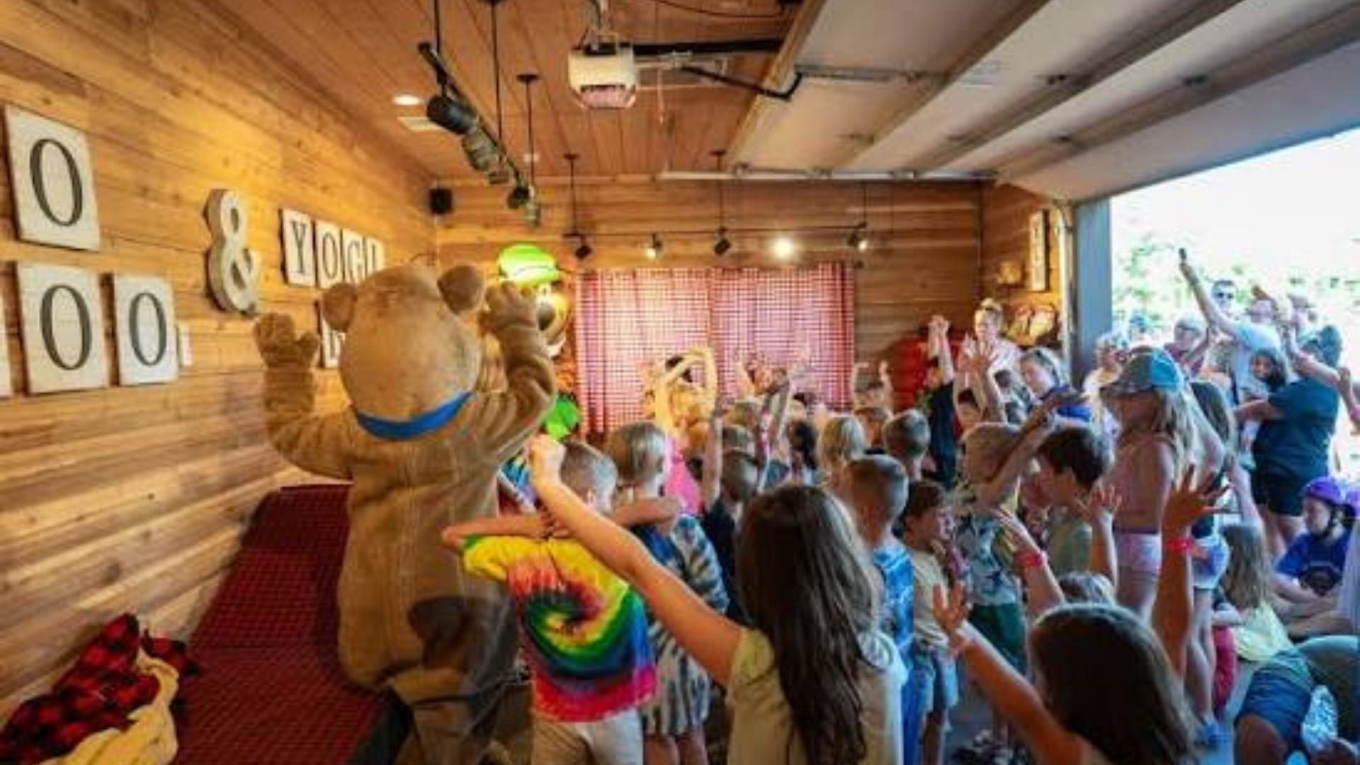 An image from Jellystone Park of the kids waking up the bears.