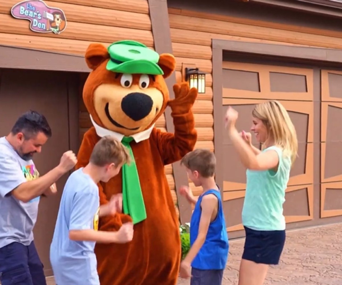 An image of a family dancing with Yogi Bear™ at Jellystone Park™ Caledonia.