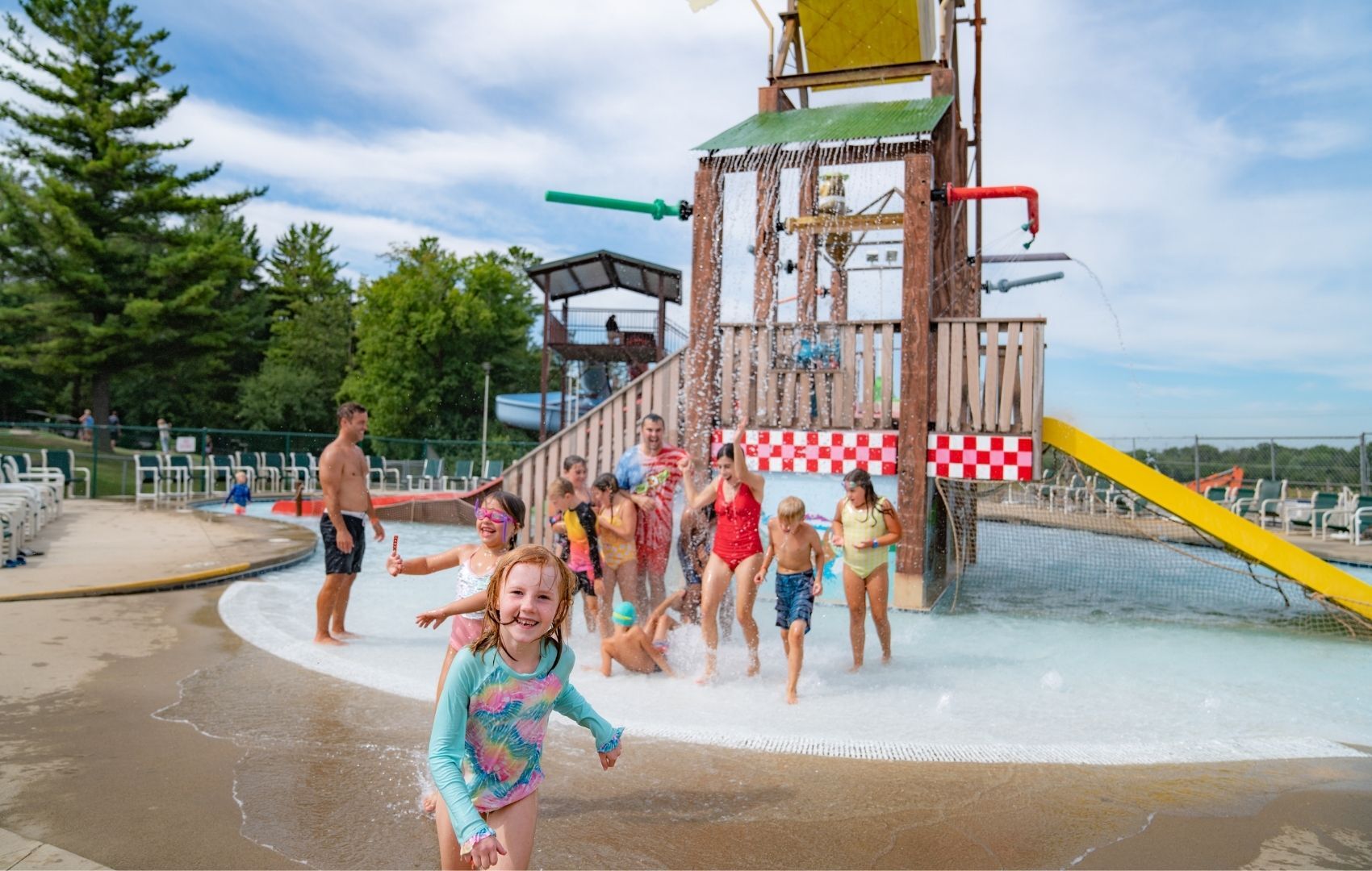 An image of kids playing at the Picnic Splash water play area at Jellystone Park™ Caledonia.